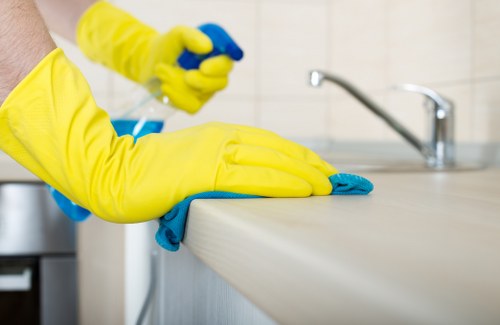 Carpet cleaning technician preparing equipment safely