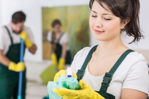 Technician using professional carpet cleaning machine